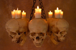 Skeletons And More "Skull Chandelier With 8 Skulls And Flameless Candles" Haunted House Lighting -Costume Types Shop skull chandelier with 8 skulls and flameless candles haunted house lighting 23696522817